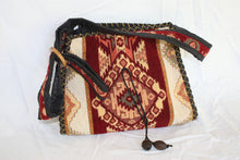 Load image into Gallery viewer, Red and gold cloth with embroidered design with cloth strap, wooden dangles and zipper enclosure
